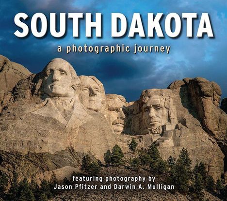 „SOUTH DAKOTA a photographic journey“: Buchcover mit Mount Rushmore unter bewölktem Himmel.