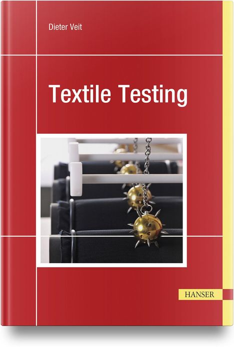 „Textile Testing“ von Dieter Veit. Rotes Cover, Bild von Maschinen mit Ketten und stacheligen Kugeln.