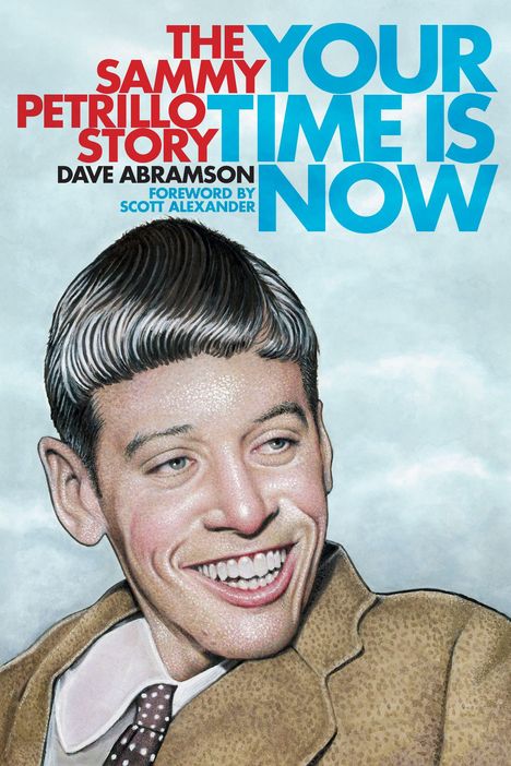 Text: "THE SAMMY PETRILLO STORY. YOUR TIME IS NOW. DAVE ABRAMSON. FOREWORD BY SCOTT ALEXANDER." Illustration eines lachenden Mannes.