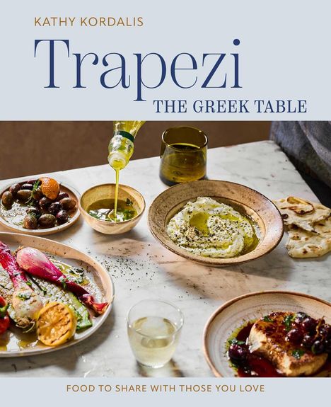 "Trapezi: The Greek Table von Kathy Kordalis. Essen auf einem Tisch: Oliven, Brot, Käse und ein Glas Wein."