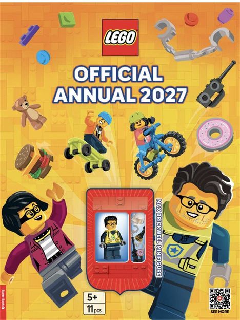 "LEGO Official Annual 2027" in großen Buchstaben. Figuren und Elemente wie ein Teddybär und Fahrrad fliegen umher.