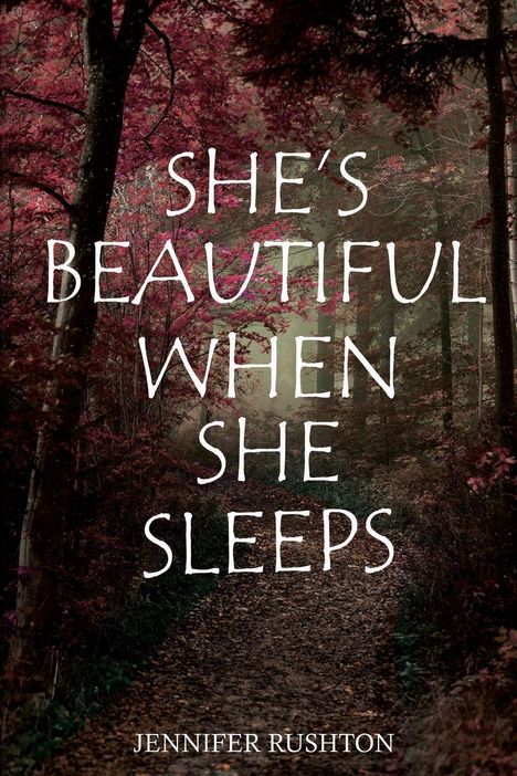 Text: "SHE'S BEAUTIFUL WHEN SHE SLEEPS" und "JENNIFER RUSHTON". Ein Waldweg mit Herbstfarben dominiert die Szenerie.