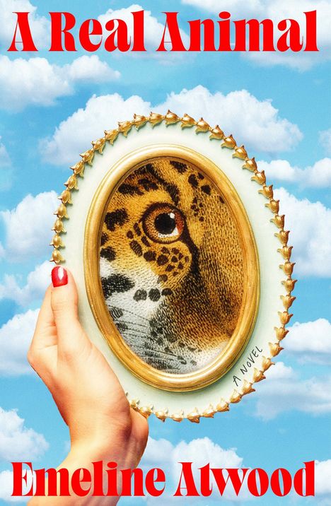 Text: "A Real Animal" und "Emeline Atwood". Eine Hand hält einen Rahmen mit einem Leopardenmuster, Himmel im Hintergrund.