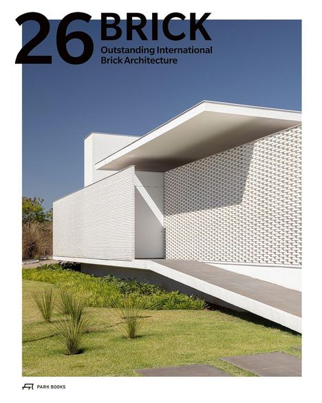 "26 BRICK Outstanding International Brick Architecture." Modernes Gebäude mit weißen Backsteinwänden und Flachdach.
