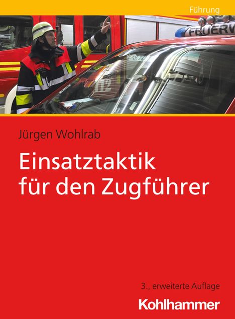 Text: "Führung", "Jürgen Wohlrab", "Einsatztaktik für den Zugführer", "3., erweiterte Auflage", "Kohlhammer". Feuerwehrmann zeigt.