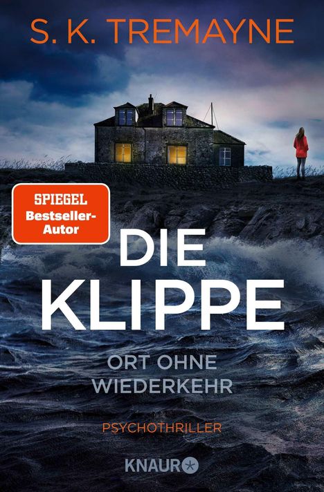 S.K. TREMAYNE: Die Klippe. Ort ohne Wiederkehr. Psychothriller. KNAUR. Dunkles Haus, beleuchtet, Frau im roten Mantel.