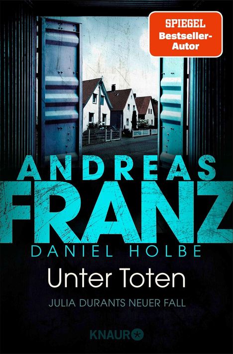 Titel: "Unter Toten" von Andreas Franz und Daniel Holbe. Ein offenes Garagentor zeigt Häuser in einer ruhigen Straße.
