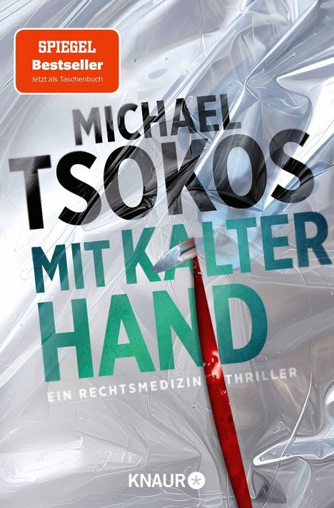 "SPIEGEL Bestseller", "Michael Tsokos", "Mit kalter Hand", "Ein Rechtsmedizin-Thriller", "Knaur". Zerknitterte Plastikfolie mit rotem Hebel.