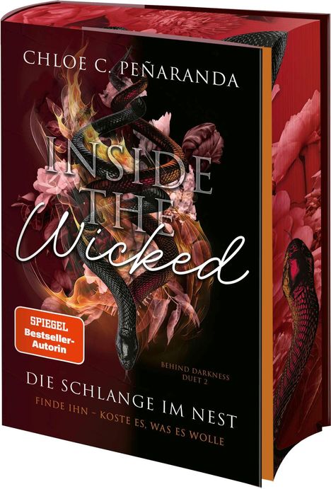 "INSIDE THE WICKED" steht groß in der Mitte, umgeben von Schlangen und floralen Elementen.