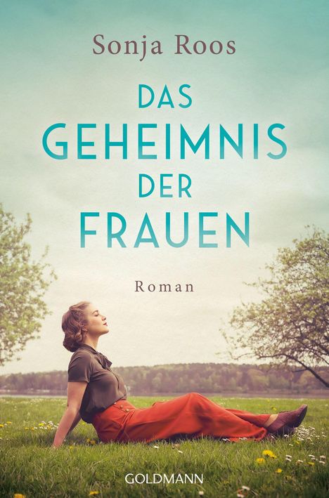 Text: "Sonja Roos, Das Geheimnis der Frauen, Roman, Goldmann". Frau sitzt auf grüner Wiese, blauer Himmel, Bäume im Hintergrund.