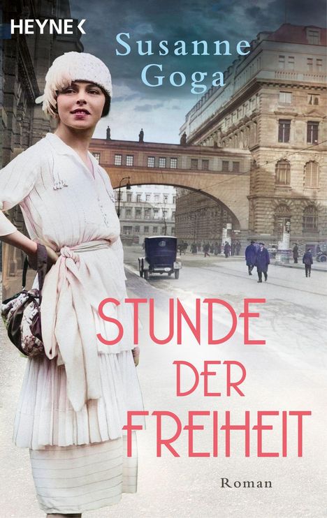 Text: "Susanne Goga - Stunde der Freiheit - Roman". Eine Frau in altmodischer Kleidung steht vor einem historischen Gebäude.