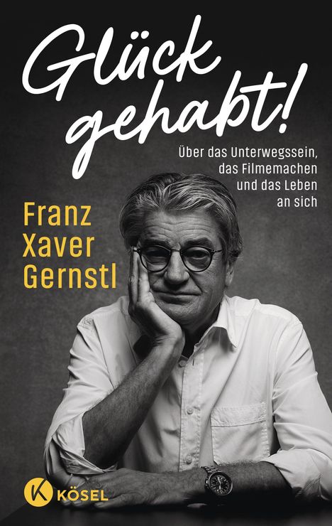 "Glück gehabt! Über das Unterwegssein, das Filmemachen und das Leben an sich. Franz Xaver Gernstl." Schwarz-Weiß-Foto eines Mannes mit Brille und Bart, Kopf auf Hand gestützt.