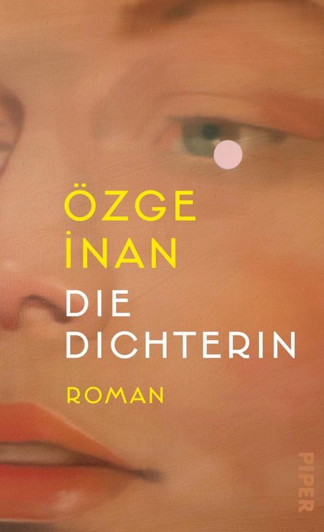 Text: "ÖZGE İNAN DIE DICHTERIN ROMAN". Ein gemaltes Gesicht im Hintergrund.