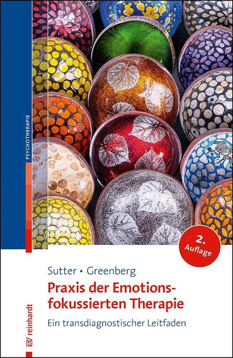 Titel: "Praxis der Emotionsfokussierten Therapie" von Sutter und Greenberg. Bunte, gemusterte Schalen in einem Kreis.