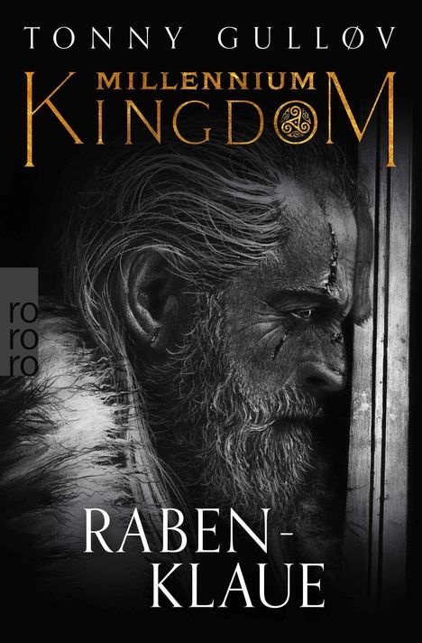 TONNY GULLØV, MILLENNIUM KINGDOM, RABENKLAUE. Ein bärtiger Mann mit Narben und ernstem Blick in Schwarz-Weiß.