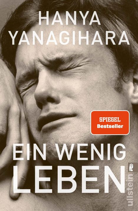 Text: „Hanya Yanagihara“, „Ein wenig Leben“, „Spiegel Bestseller“. Ein Gesicht in Nahaufnahme mit einem schmerzhaften Ausdruck.