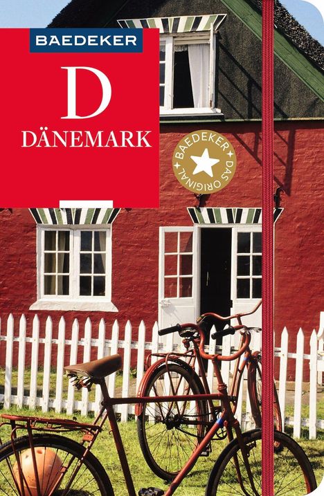 „Baedeker Dänemark“. Rotes Haus, weißer Zaun, zwei Fahrräder im Vordergrund.