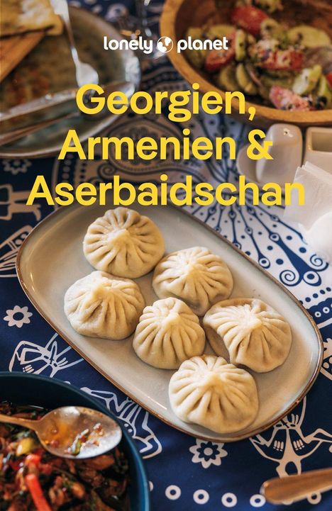 Text: "Georgien, Armenien & Aserbaidschan." Darunter gefüllte Teigtaschen auf einem blauen Mustertuch.