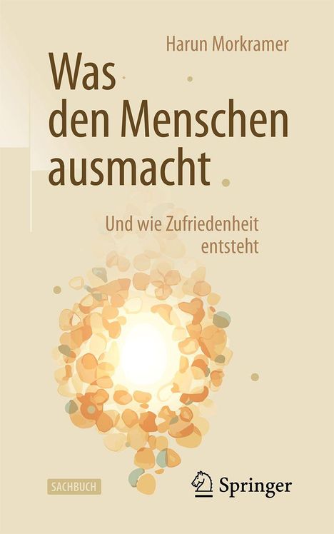 Text: "Was den Menschen ausmacht", "Und wie Zufriedenheit entsteht", "Harun Morkramer", "Sachbuch", "Springer".  
Design: Sanfte, cremefarbene Töne mit stilisiertem Leuchten-Muster.