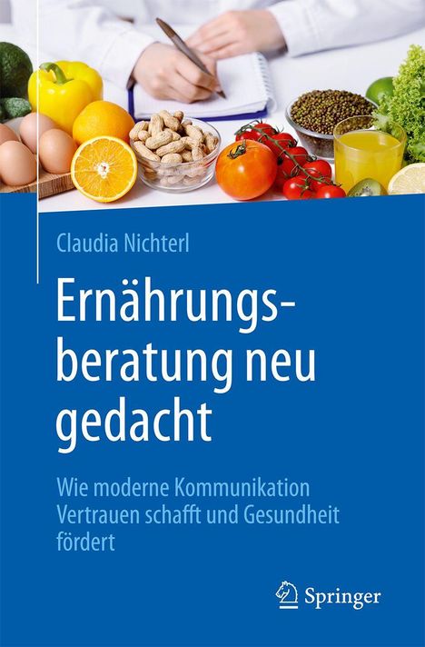 "Ernährungsberatung neu gedacht" - Buch über Kommunikation und Gesundheit. Obst, Gemüse und Notizbuch im Hintergrund.