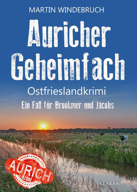 Text: "Auricher Geheimfach. Ostfrieslandkrimi. Ein Fall für Brookmer und Jacobs. Martin Windebruch." Landschhaft mit Kühen und Sonnenuntergang.
