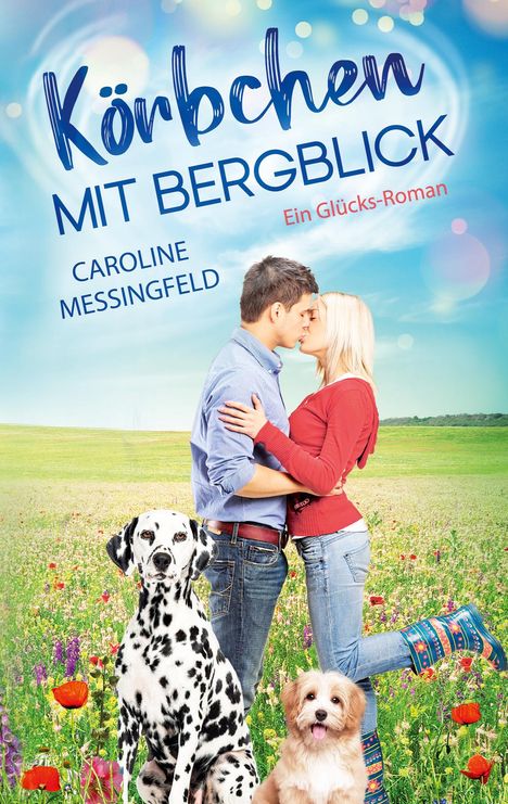 Text: "Körbchen mit Bergblick", "Caroline Messingfeld", "Ein Glücks-Roman". Ein Paar küsst sich auf einer Blumenwiese, zwei Hunde.