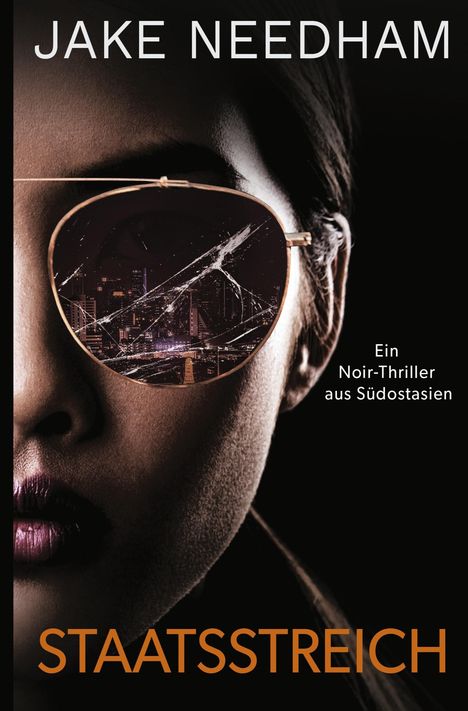 "JAKE NEEDHAM STAATSSTREICH. Ein Noir-Thriller aus Südostasien." Gesicht mit Sonnenbrille, zeigt Stadtlandschaft.