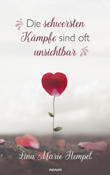 „Die schwersten Kämpfe sind oft unsichtbar.“ Einzelnes rotes Blütenblatt, das wie ein Herz geformt ist, auf grauem Hintergrund.