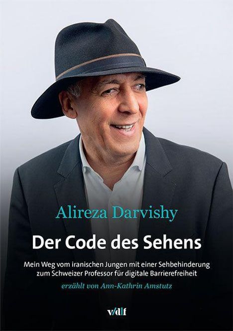 Alireza Darvishy: "Der Code des Sehens". Ein Mann in Anzug und Hut lächelt leicht.