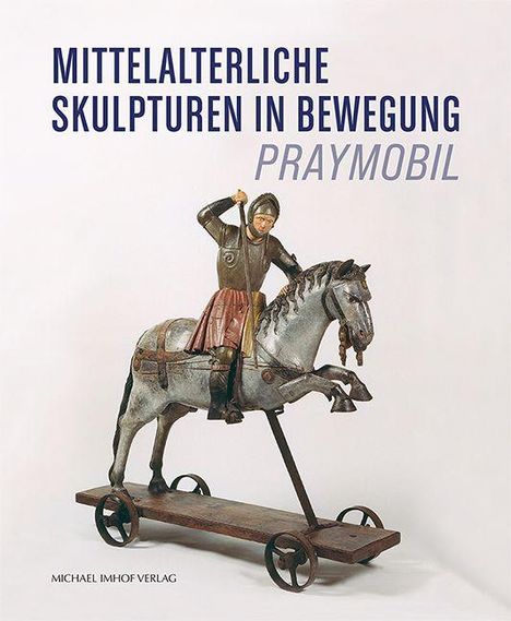 „MITTELALTERLICHE SKULPTUREN IN BEWEGUNG, PRAYMOBIL“. Skulptur eines Ritters auf einem Pferd, montiert auf Rädern.