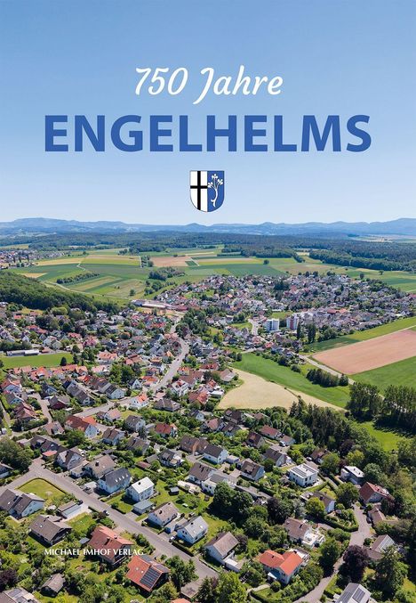 "750 Jahre ENGELHELMS" mit einem Wappen. Luftaufnahme eines ländlichen Dorfes mit Feldern und Hügeln im Hintergrund.