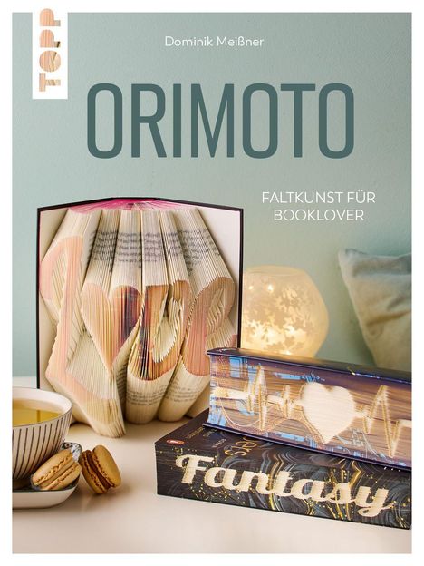 "Dominik Meißner, ORIMOTO, Faltkunst für Booklover". Buchseiten sind kunstvoll gefaltet, Herzmuster und "Fantasy".