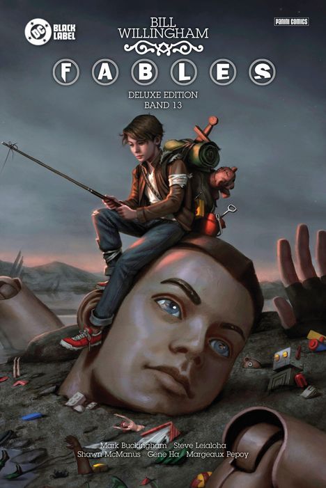 "Bill Willingham Fables Deluxe Edition Band 13." Ein Junge angelt auf einem riesigen, teils vergrabenen, kaputten Kopf.