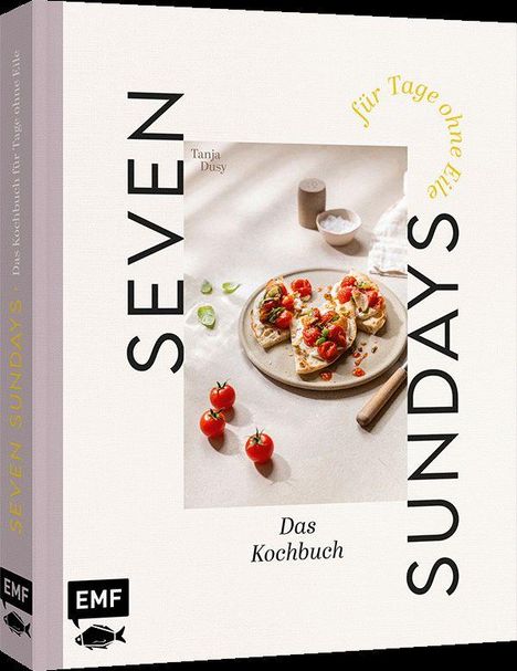 "SEVEN SUNDAYS", "Das Kochbuch", "für Tage ohne Eile", "Tanja Dusy". Ein Teller mit Brot und Tomaten, Basilikum daneben.