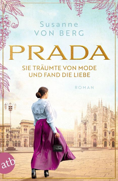 "Susanne von Berg. PRADA. Sie träumte von Mode und fand die Liebe. Roman." Eine Frau steht vor einem großen Gebäude.