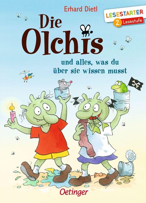 Titel: "Die Olchis und alles, was du über sie wissen musst". Zwei grüne Figuren mit großen Nasen lächeln.