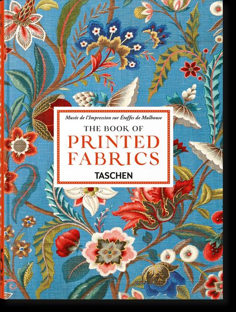 Text lautet: "The Book of Printed Fabrics", "Taschen". Lebhaftes florales Muster auf blauem Grund.