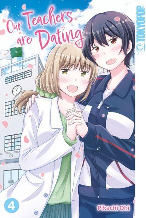 „Our Teachers are Dating“, Pikachi Ohi; zwei lächelnde Frauen in Umarmung, Blütenblätter, Schulgebäude im Hintergrund.