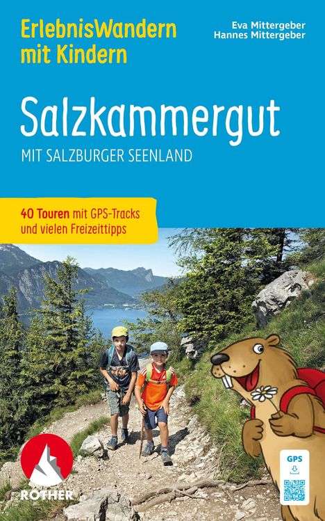 ErlebnisWandern mit Kindern, Salzkammergut, 40 Touren. Zwei Kinder wandern auf einem Bergpfad, daneben ein fröhliches Murmeltier.