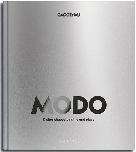 Text: "GAGGENAU" oben, "MODO" in der Mitte, "Dishes shaped by time and place" darunter. Silberner Buchumschlag.