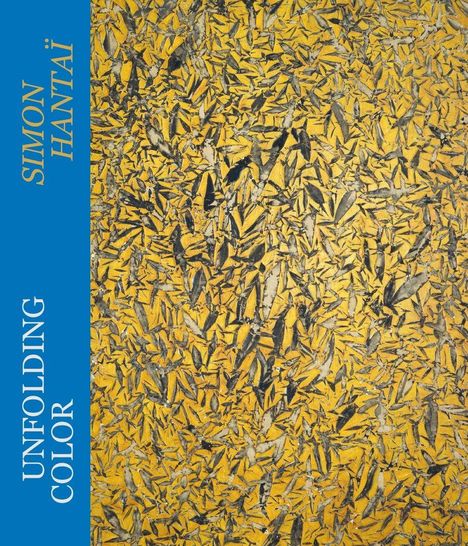 Text links: "SIMON HANTAÏ", "UNFOLDING COLOR". Abstrakte, gelb-dominierte Muster mit schwarzen Akzenten.