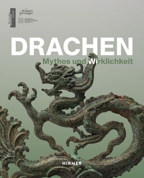„DRACHEN: Mythos und Wirklichkeit“. Skulptur eines detailreichen Drachen auf grauem Hintergrund.