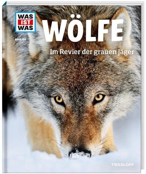 "WAS IST WAS, Band 104, Wölfe, Im Revier der grauen Jäger." Ein Wolf blickt frontal in einer verschneiten Landschaft.