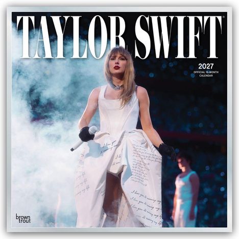 Text oben: "TAYLOR SWIFT". Text rechts: "2027 OFFICIAL 16-MONTH CALENDAR". Frau im weißen Kleid mit Mikrofon vor Publikum.