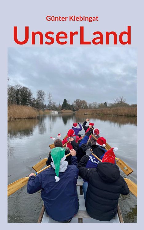 Text: „Günter Klebingat UnserLand“. Menschen paddeln in einem Boot, tragen bunte Weihnachtsmützen.