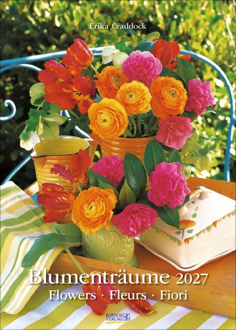 "Blumenträume 2027" ist der Titel. Bunte Blumen: Rot, Orange, Pink. Ein Tisch mit Streifentuch und Geschirr.