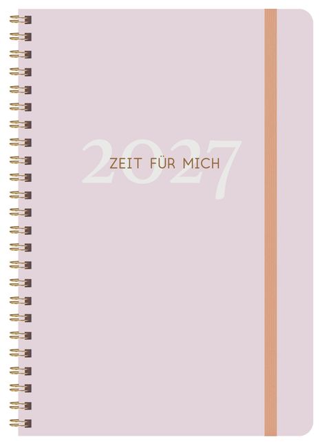 Text "2027" und "ZEIT FÜR MICH" auf einem blassrosa Notizbuch mit Goldspiralbindung und rosa Gummiband.