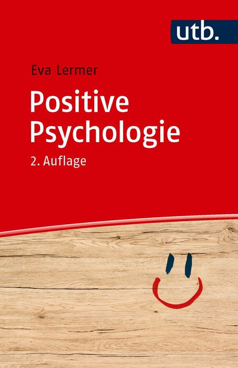 Titel: Positive Psychologie. Autor: Eva Lermer. 2. Auflage. Roter Hintergrund, Holzmaserung mit Smiley. Oberes Logo "utb".