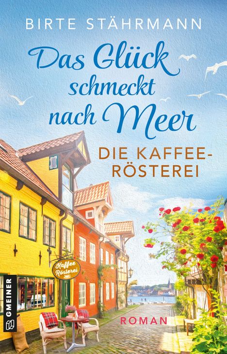 "Das Glück schmeckt nach Meer. Die Kaffeerösterei. Roman. Bunte Gasse mit gelben und roten Häusern, Blumenterrasse."