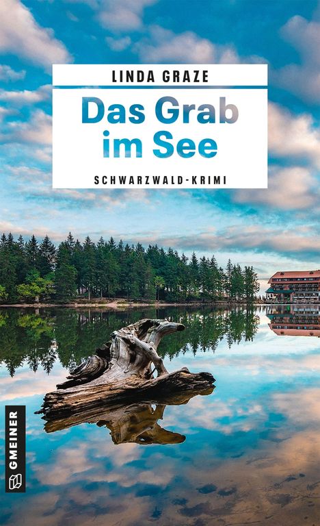 "Linda Graze: Das Grab im See. Schwarzwald-Krimi." Vor einem ruhigen See mit Spiegelung von Wolken und Wäldern.